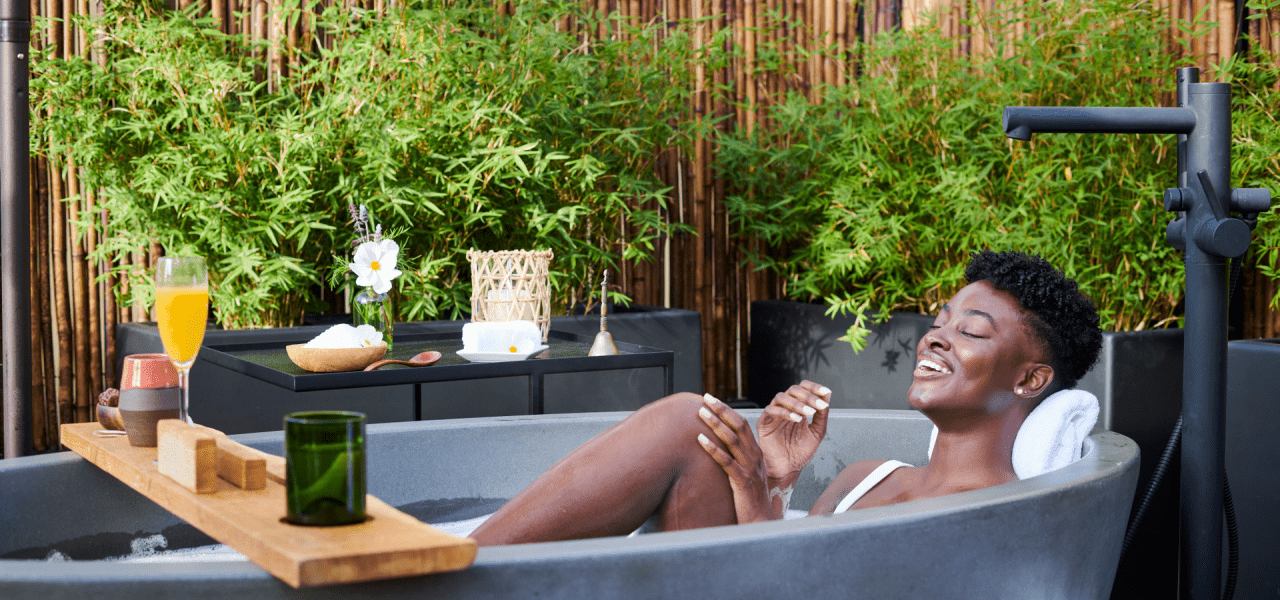 Woman in Bamford rooftop tub 